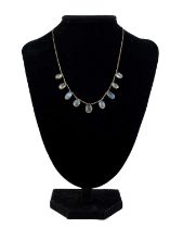 A gold set blue Moonstone fringe necklace.