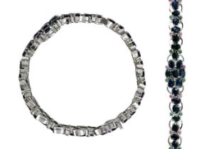 A contemporary 925 silver sapphire bracelet with emerald and ruby accents.
