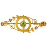 An Edwardian 15ct gold (tested) peridot and seed pearl set brooch.