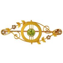 An Edwardian 15ct gold (tested) peridot and seed pearl set brooch.