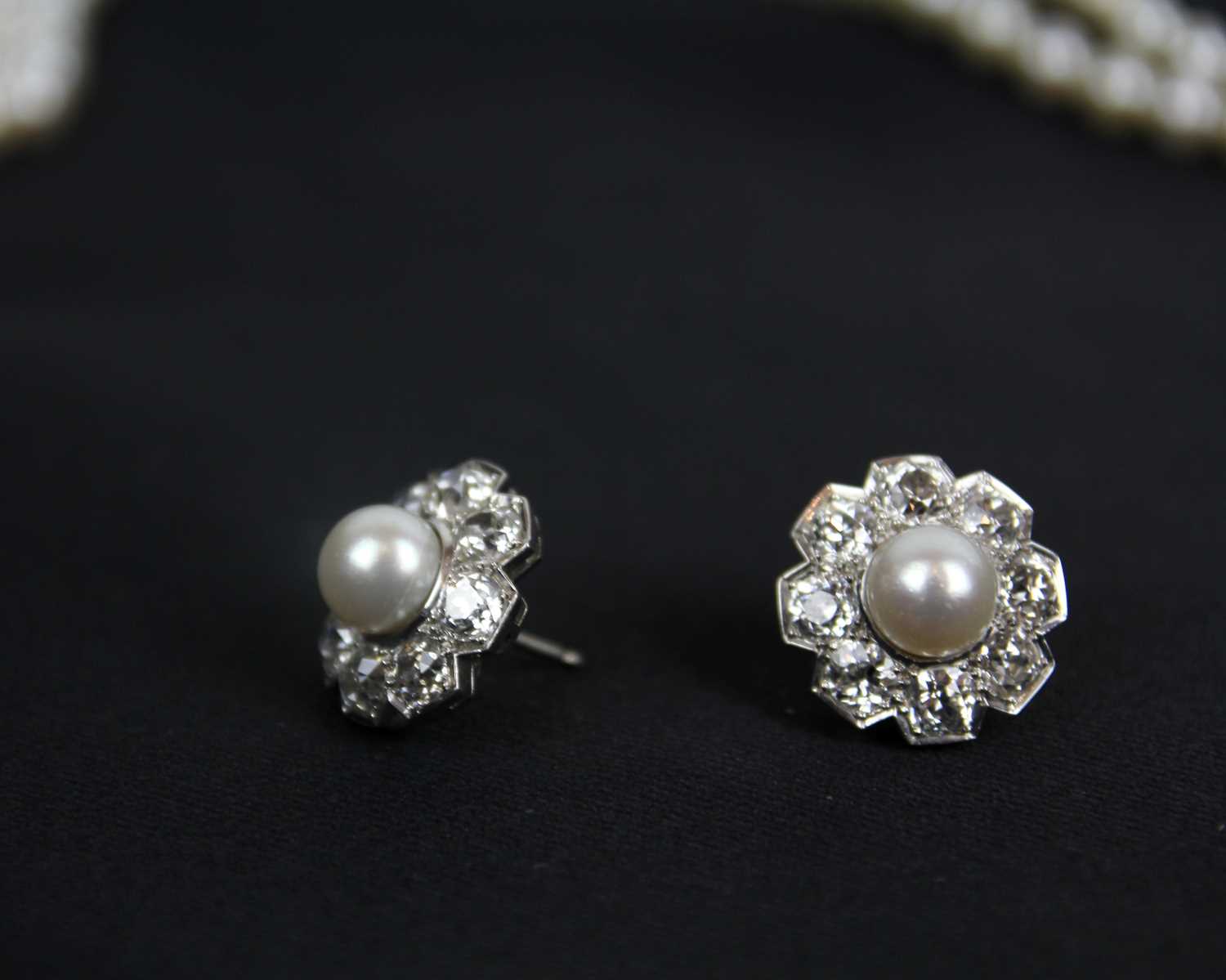 An impressive early 20th century cultured pearl, diamond set, double-row necklace & earrings suite. - Image 2 of 9
