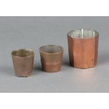 A 19th Century octagonal copper mould/measure 6cm x 4cm, 2 other moulds/measures 4cm x 4cm