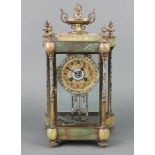 A 19th Century French 8 day four glass clock of shaped outline, the 8cm gilt dial with roundels
