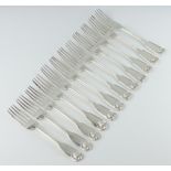 A matched set of 12 Victorian silver fiddle and shell pattern dinner forks, London 1841, 1851, by