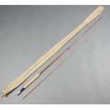 A Hardy Perfection split cane 9', 2 piece fly fishing rod, contained in a green cloth bag
