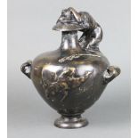 After the antique, a bronze twin handled and lidded urn decorated a crab to the top 31cm x 24cm