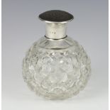 An Edwardian style silver and tortoiseshell lidded glass toilet bottle 12cm, rubbed marks
