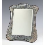 An Art Nouveau style repousse silver easel frame mirror, London 1983 30cm x 24cm