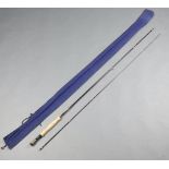 A Hardy graphite deluxe 9', 2 piece trout fishing rod with 6/7 line weight in a blue bag