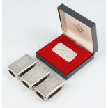 A set of 3 silver engine turned match box holders, monogrammed V, together with an ingot, 90 grams