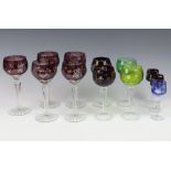 Five amethyst hock wine glasses with vinous decoration, 2 smaller red ditto, 1 pail (chipped), 1