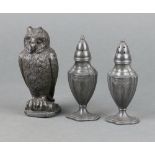 A pair of Adam style pewter pepperettes, the base marked Astor by Poole 11cm h x 4cm, together