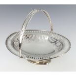 A silver swing handle basket with pierced decoration and presentation inscription Sheffield 1922,