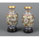 A pair of 20th Century Chinese cloisonne enamelled club shaped vases on hardwood stands, cased