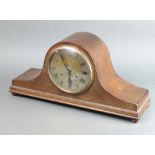 A 1920's chiming mantel clock with silvered dial and Roman numerals, contained in an oak Admiral's