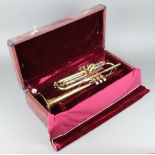 A Parrot brass trumpet compete with mouthpiece, cased