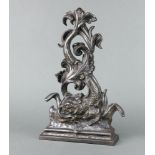 A cast iron door stop in the form of a dolphin 39cm x 24cm x 6cm