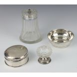 An Edwardian glass shaker with pierced silver lid, a shallow dish, circular box and table salt