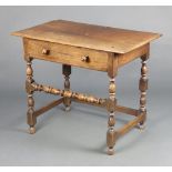 A 17th Century style oak side table fitted a frieze drawer, raised on turned and block supports with