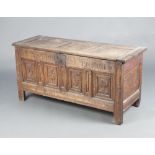 A 17th/18th Century bleached carved oak coffer with hinged lid, the front marked To The Por For
