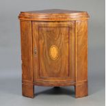 A 19th Century inlaid mahogany bow front corner cabinet with stepped top, the base enclosed by a