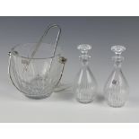 A Baccarat Crystal ice bucket and tongs, a pair of ditto oil bottles 16cm