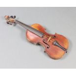 A facsimile Stradivarius violin with 34cm one piece back, label reads "Antonius Stradivarius