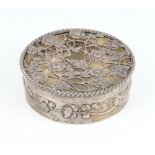 An Edwardian circular silver box with pierced floral lid, London 1907 8cm, 84 grams