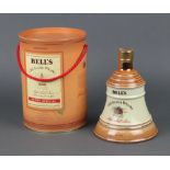 A 70cl Wade bell shaped decanter of Bells whisky Possible leakage
