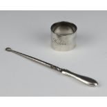 A silver napkin ring together with a silver mounted button hook, London 1942