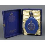 A bottle of 21 year old Long John Royal Choice Blended Scotch Whisky contained in a plush box (hinge