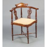 An Edwardian inlaid mahogany slat back corner chair with upholstered seat, raised on turned supports