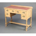 An Edwardian bleached oak writing table with raised back and inset writing surface, above 2 long and