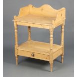 A Victorian style pine 2 tier wash stand with 3/4 gallery, the base fitted a drawer, raised on
