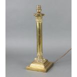 A brass Corinthian column table lamp on a square base 38cm x 15cm x 15cm
