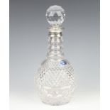 A cut glass mallet shaped decanter and stopper with silver collar, Birmingham 1994, 29cm