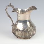 A Victorian silver cream jug with demi fluted and acanthus decoration Sheffield 1900, 294 grams