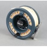 An Orvis large arbor 7/8 fishing reel with pouch