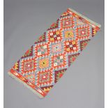 A turquoise, brown and white ground Chobi Kilim runner 146cm x 64cm