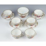 A German porcelain part tea set comprising 6 tea cups, 4 saucers and a sugar bowl decorated with