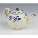 An 18th Century Worcester style teapot with half ribbed decoration, decorated with flowers holding a