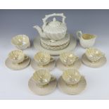 A Belleek tea set of shell form comprising teapot, 6 tea cups, milk jug, sugar bowl, 6 saucers, 6