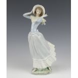 A Lladro figure of a standing lady 35cm