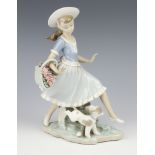 A Lladro group of a girl with basket of flowers and poppy 25cm