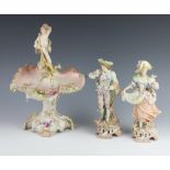 A pair of 19th Century German porcelain figures of standing lady and gentleman with birds 25cm h (
