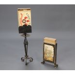 A 1920's wrought iron oversized matchbox holder with box of matches, the base incorporating an