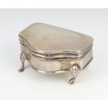 A George V silver trinket box of serpentine form on pad feet Birmingham 1912, 7cm This lot is dented