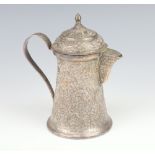 A Persian white metal coffee jug decorated with scrolling flowers 18cm, 292 grams