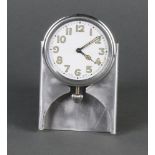 A 1940's Swiss car clock with enamelled dial and Arabic numerals contained in an aluminium case