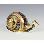 A Royal Crown Derby Imari pattern paperweight - garden snail no.699 of 4500 by Sue Rowe with gold
